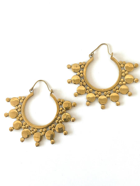 Handmade Mali large hoop earrings in brass, featuring a distinctive array of circles, adding a bold and beautiful touch to any ensemble.